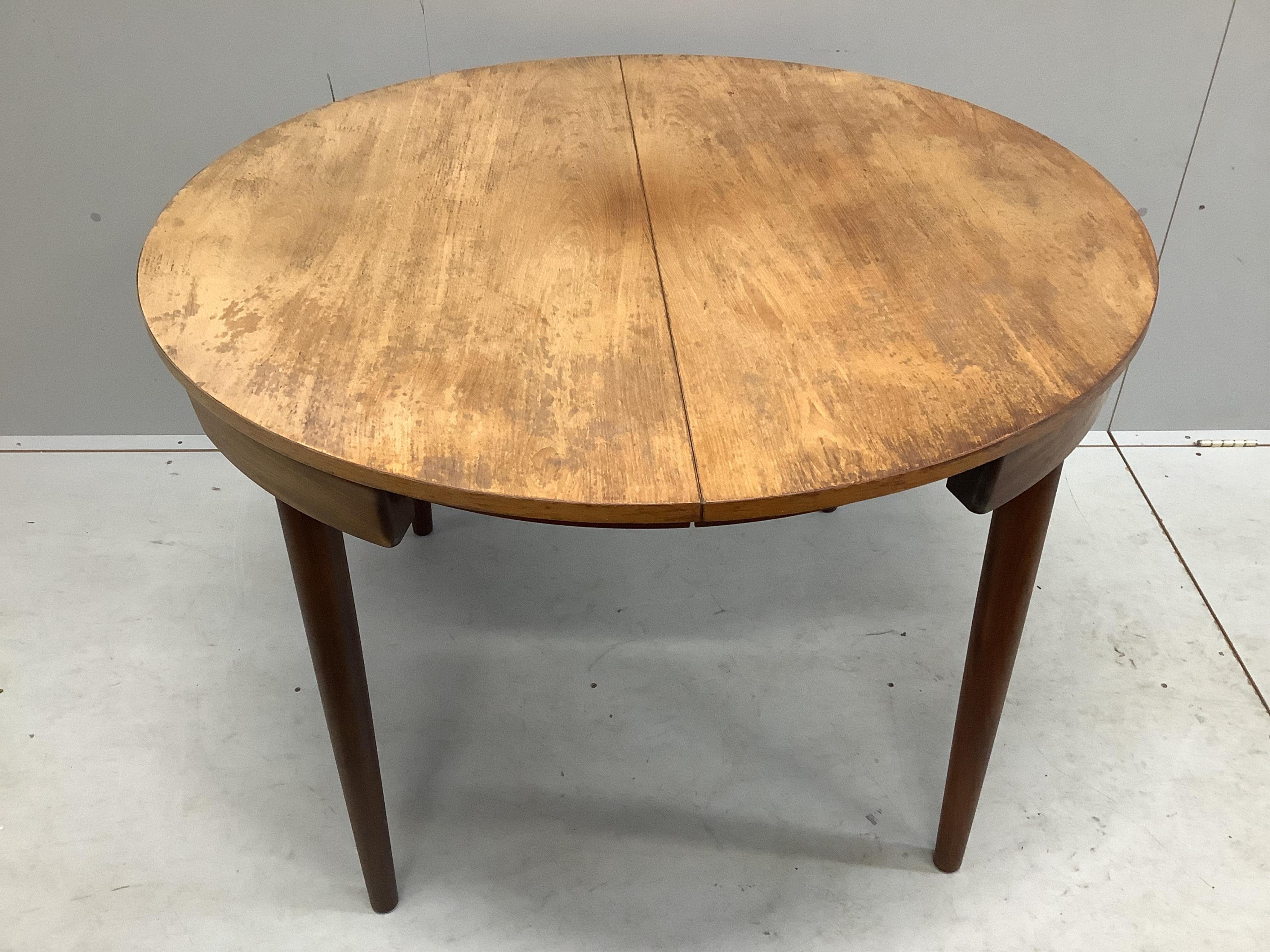 Hans Olsen for Frem Rojle, a mid century Danish teak 'Roundette' dining table, 156cm extended, depth 106cm, height 74cm together with four chairs. Condition - fair, top severely sun faded